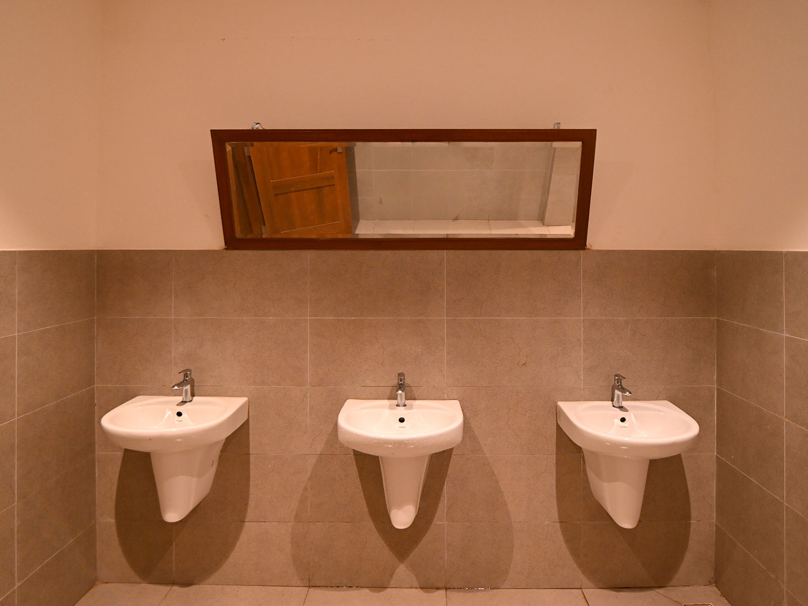 Clean modern restrooms with marble tiles